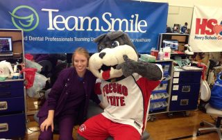 Fresno State mascot TimeOut at TeamSmile dental care event.