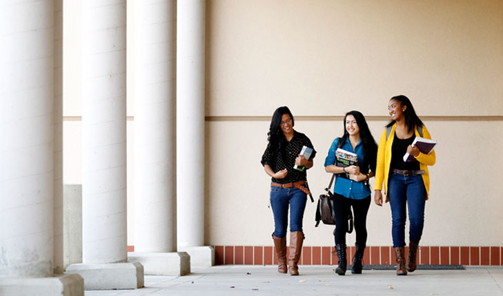 Students walking by the music building