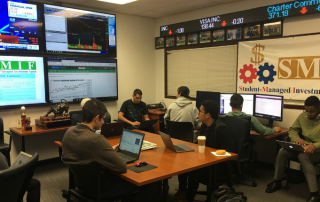 Students in the R. Stephen Heinrichs Trading Room