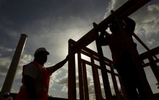 silhouette of construction workers