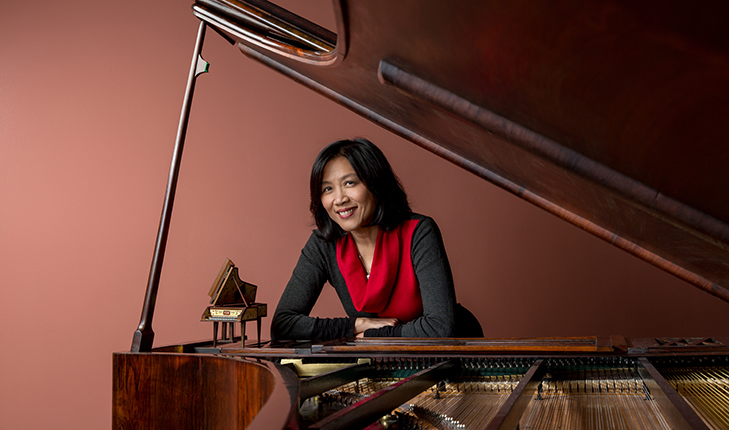 Gwendolyn Mok sitting at a piano