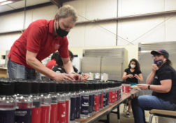 Dr. Stephan Sommer and students produce the first-ever batch of Bulldog hand sanitizer that is now being sold at the Gibson Farm Market.