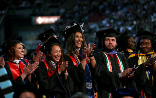 Students clap during the 2019 Fresno State Commencement.