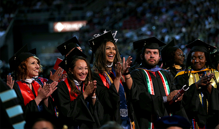 Students clap during the 2019 Fresno State Commencement.