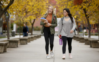 Fresno State students walk through campus on a fall day.