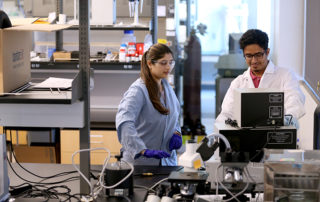 Two students work in the Jordan Agricultural Research Center.