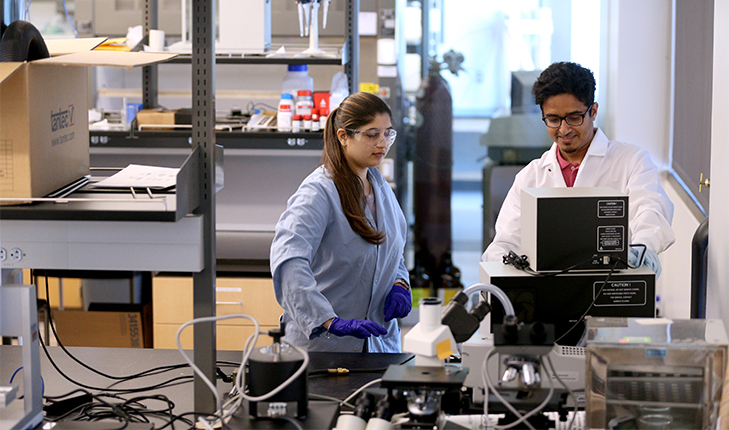 Two students work in the Jordan Agricultural Research Center.