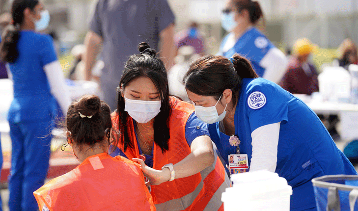 Fresno State nursing students provide vaccinations to the community.