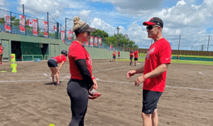 Wade Gilbert, right, mental performance coach for the Canadian national softball team.