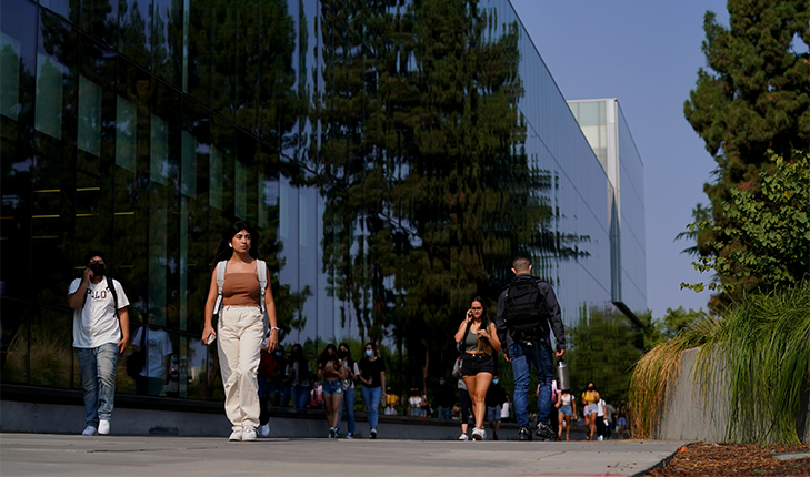 Students walking past the Henry Madden Library