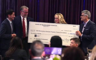 Melodie Rogers presents a check for $1 million to Fresno State for the George and Melodie Rogers Foundation Renaissance Scholars Summer Internship Program Endowment