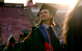 Student looking up during graduation ceremony,\.