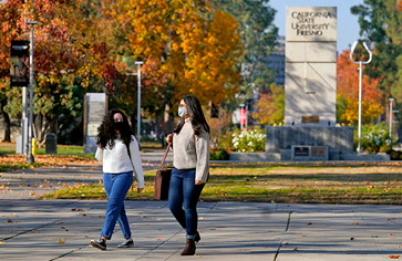 Two Students Walking on Campus