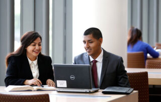 Business students working in the library