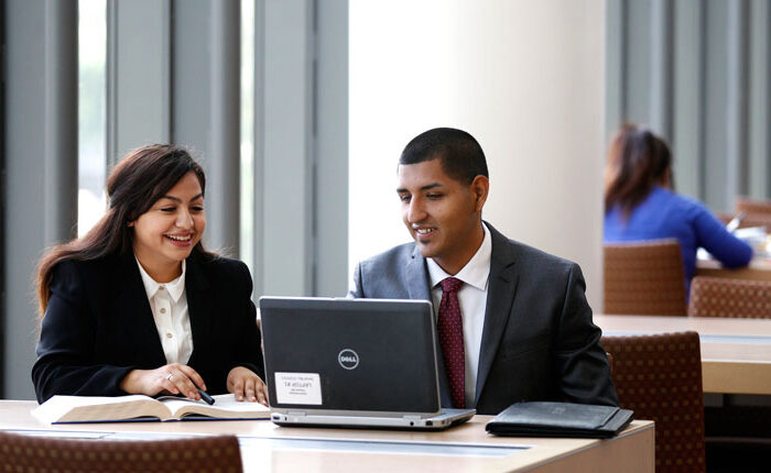 Business students working in the library
