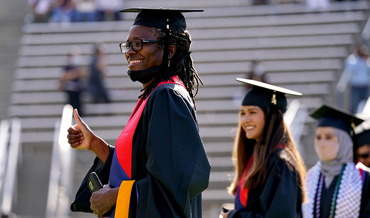 Fresno State students walking at graduation ceremonies.