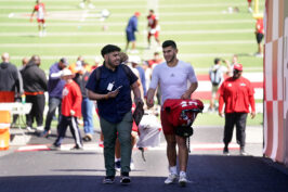 Fresno State student Jesús Cano interviews Bulldog player Abraham Montano at the Bulldog Stadium.