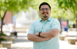 Jesus Gutierrez Plascencia poses for a picture of the Memorial fountain.