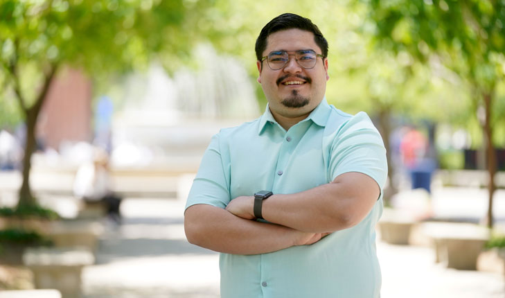 Jesus Gutierrez Plascencia poses for a picture of the Memorial fountain.