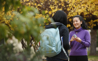 Dr. Joy Goto speaks to a student.