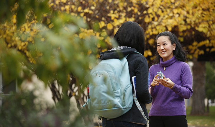 Dr. Joy Goto speaks to a student.