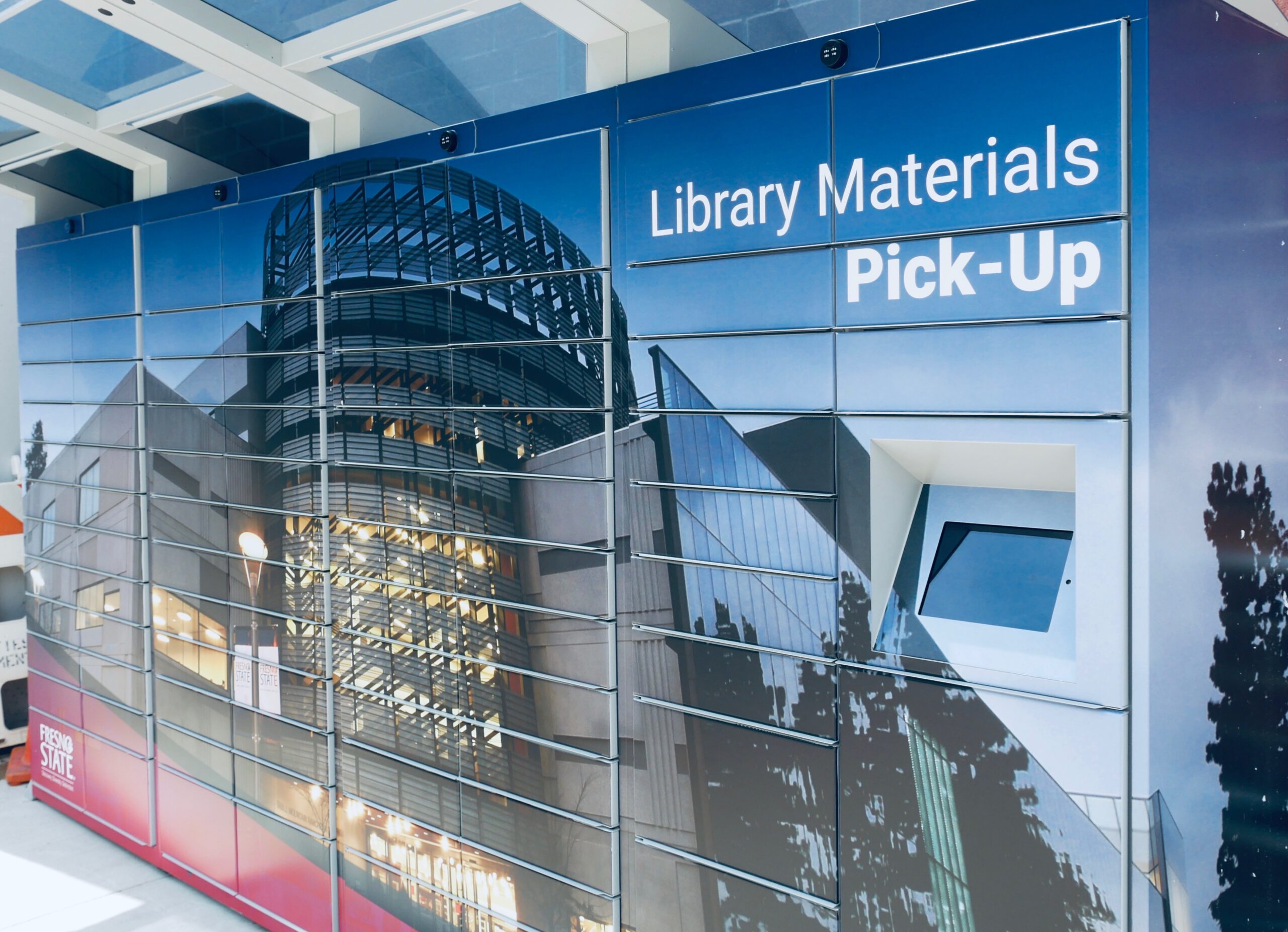 Blue lockers with a picture of the Henry Madden Library, the words "Library Materials Pick Up" are printed in the top right corner.