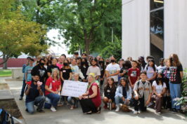 Bullard Talent students pose with check.