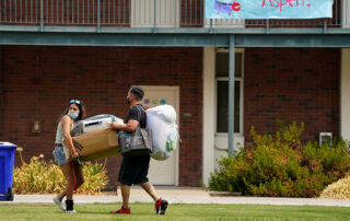 Student moving into dorm.