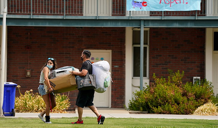 Student moving into dorm.