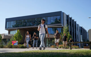 Fresno State students walking past the new Resnick Student Union.