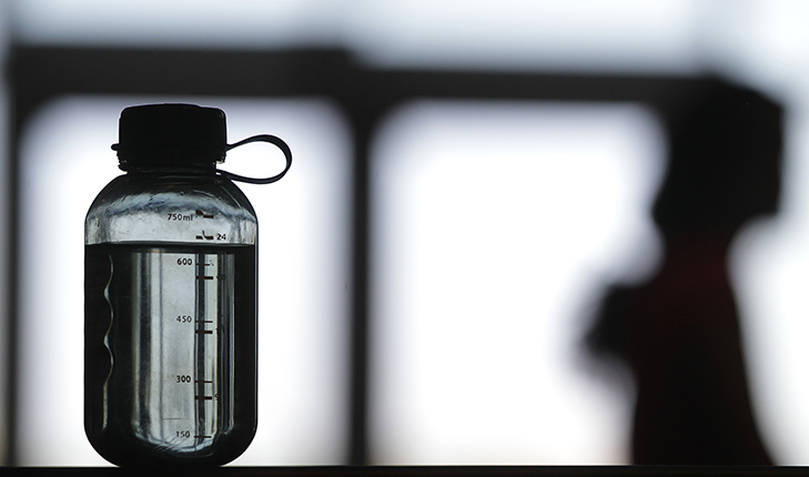 close up shot of water bottle with a blurred background.