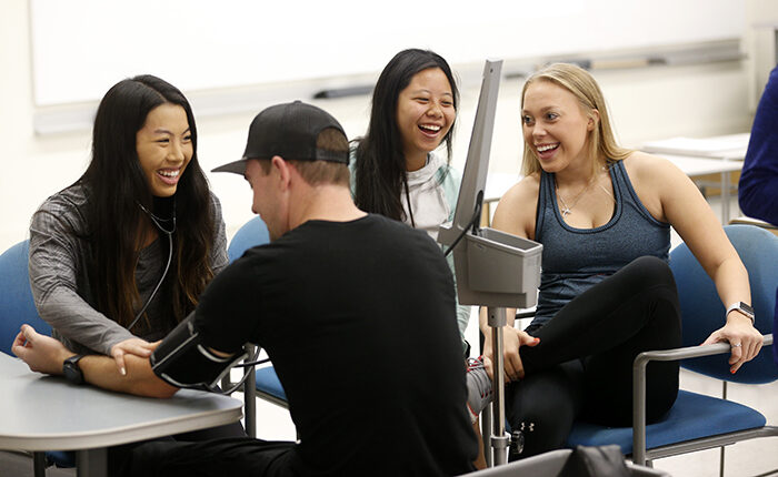Students practice medical skills.