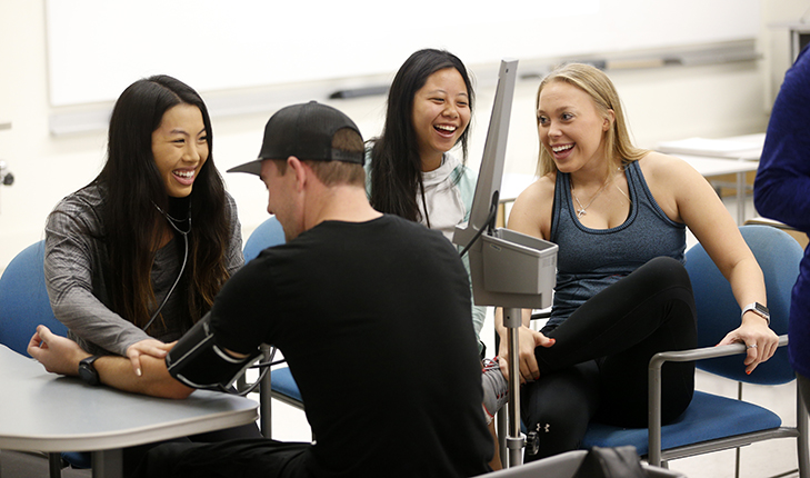 Students practice medical skills.