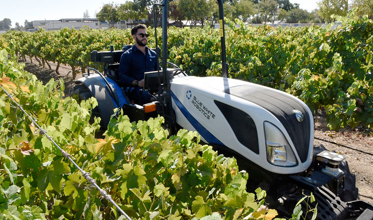 Yanir Ariav driving tractor.