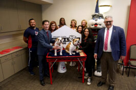 Fresno State President Saul Jimenez-Sandoval greets Victor E. Bulldog IV at his introductory press conference at the Smittcamp Alumni House at Fresno State.