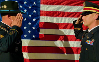 soldiers in front of American flag