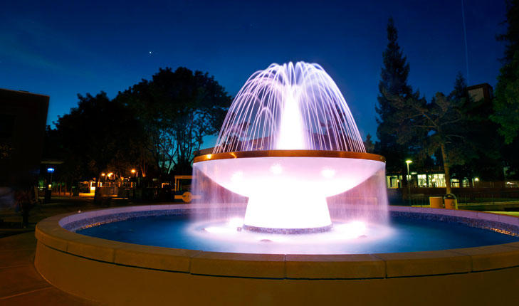 Fresno State water fountain at night.