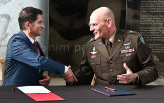 President Saúl Jiménez-Sandoval shaking hands with General Christopher J. Dziubek.