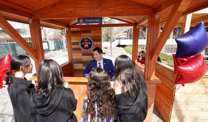 University President Saul Jimenez-Sandoval opens a new president's booth on campus to meet face-to-face with students.