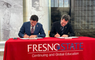 Fresno State President Saúl Jiménez-Sandoval and Dr. Michael Baum, executive council for the Luso-American Development Foundation, met March 20 at the Fresno State Library and signed an agreement creating a new study abroad pathway through the Study in Portugal Network.