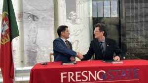 Fresno State President Saúl Jiménez-Sandoval (left) and Dr. Michael Baum, executive council for the Luso-American Development Foundation, agreed on a new study abroad pathway for Fresno State students to study in Portugal.