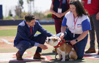 Fresno State President Saul Jimenez-Sandoval places the ceremonial collar on Victor E. Bulldog IV.