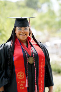 Portrait of Cherika Gamble in graduation cap and gown.
