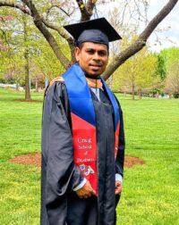 Portrait of Karthik Selvaraj in graduation cap and gown.