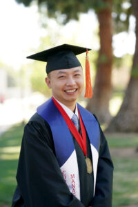 Portrait of Kiet Duong in graduation cap and gown.