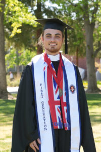 Portrait of Nicholas McKenna in graduation cap and gown.