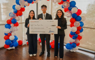 Students holding check