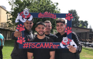 Students holding Summer Program sign