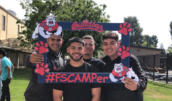 Students holding Summer Program sign