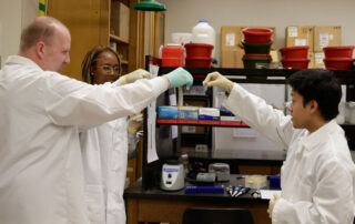 Dr. Joseph Ross and students in the lab.